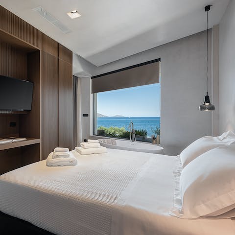 Admire the scenery from the bed or en-suite tub