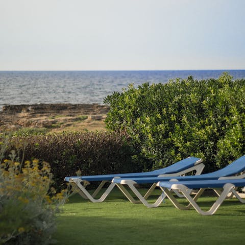 Sprawl out on the sunloungers and admire the coastal views