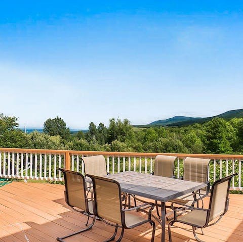 Admire breathtaking views of the Catskills from the outdoor deck
