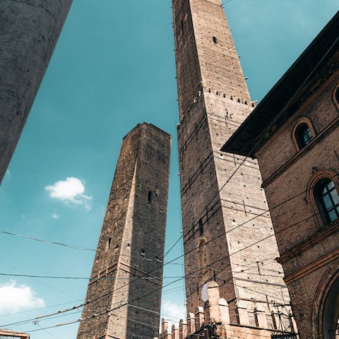 Gaze up at the Two Towers, Asinelli and Garisenda, a ten-minute walk away