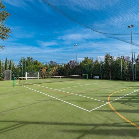Play tennis, football or volleyball with your family on the multi-purpose games area