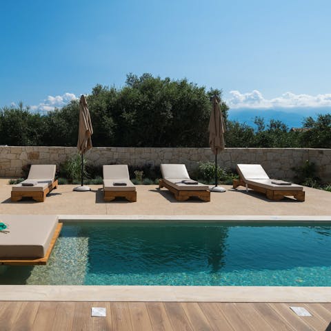 Spend the day lounging by the two private pools