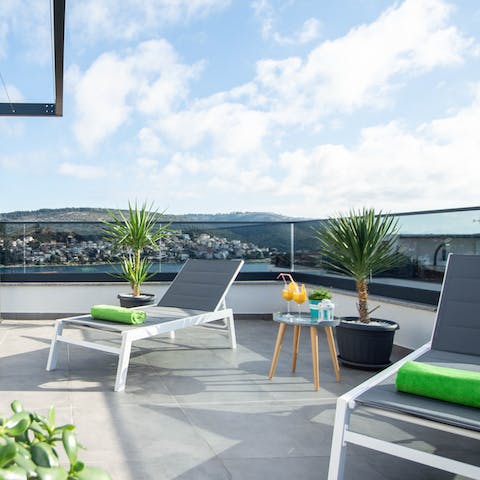 Stretch out on a sun lounger and admire the marvellous sea views