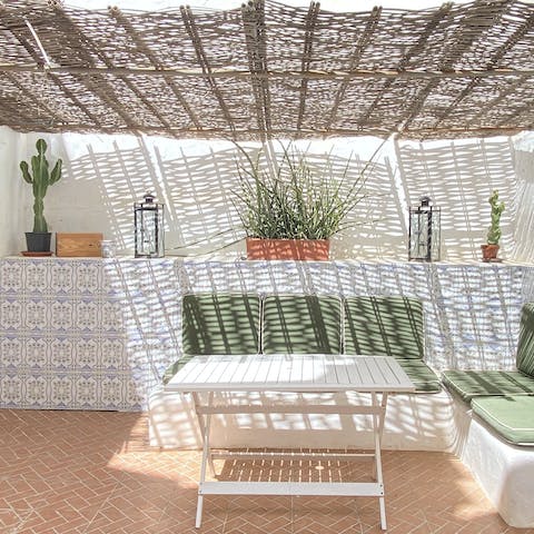 Unwind under the dappled light and sip sangria in one of several outside spaces here