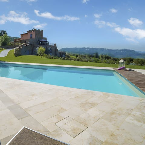 Go for a dip in the private pool overlooking the serene tuscan landscape