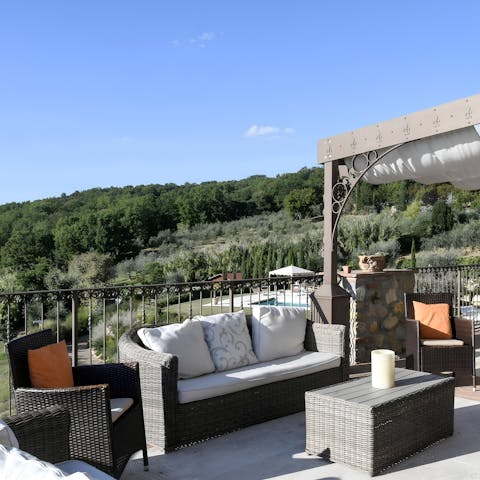 Sip an Aperol Spritz at the terrace lounge after a hike in the Tuscan hills