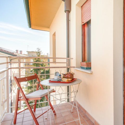 Sip your morning coffee on the private balcony
