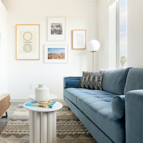 Admire the curated selection of ceramics and wall art in the living room