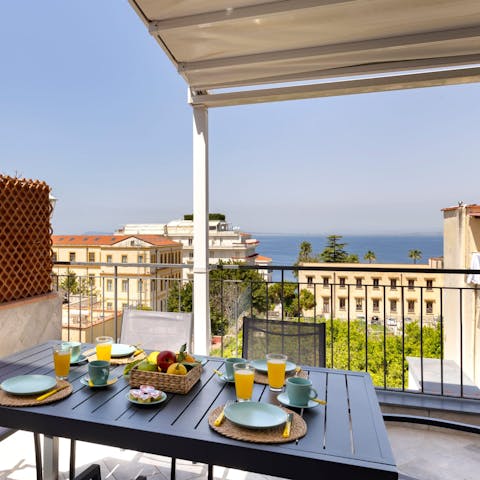 Enjoy breakfast on the terrace with views out to sea