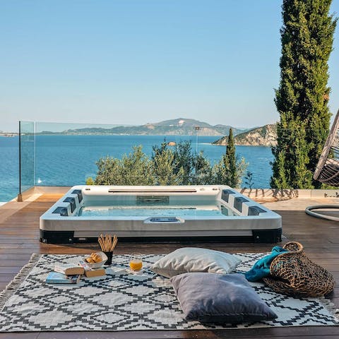 Watch the sunset with a glass of wine from the private hot tub