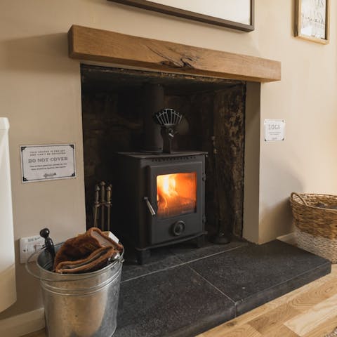 Cosy up by the wood-burning stove on chilly evenings