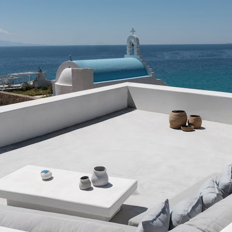 Take in stunning views over the Aegean Sea from the rooftop terrace