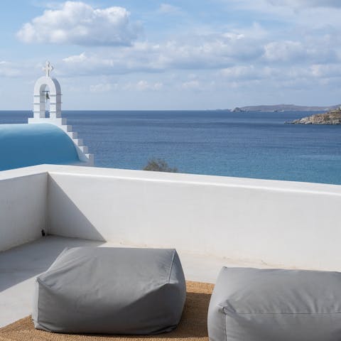 Take in stunning views over the Aegean Sea from the rooftop terrace