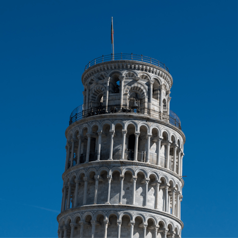 Marvel at the Leaning Tower of Pisa, only a short stroll away