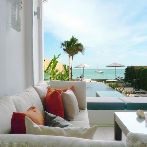 Relax in the dreamy lounge area while you gaze out at views of the blue ocean