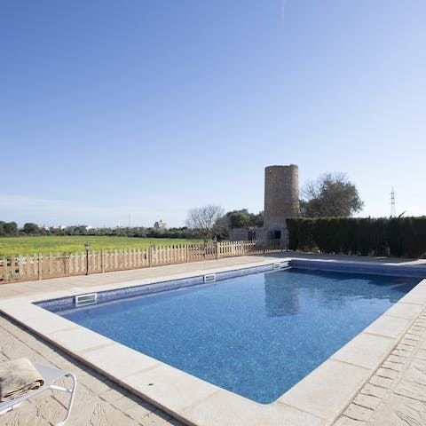 Unwind with a few laps in the pool, surrounded by fields