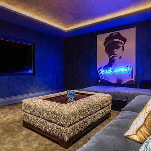 Enjoy a magical night at the movies in the home cinema room