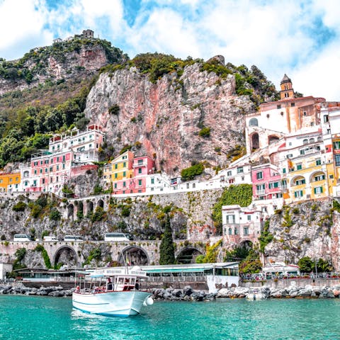 Admire the pastel-hued towns of the inimitable Amalfi Coast