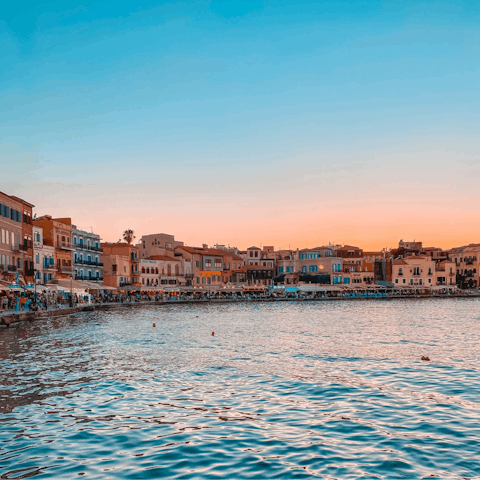 Drive twenty-five minutes to explore the ancient Venetian port of Chania