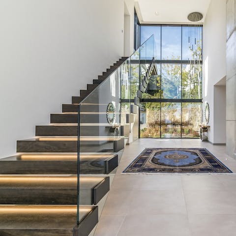 Prepare to make an entrance into the grand foyer of this designer home  