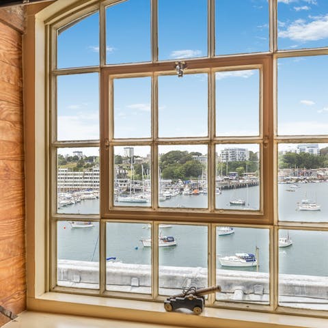 Gaze out at the boats in the water from the living room window