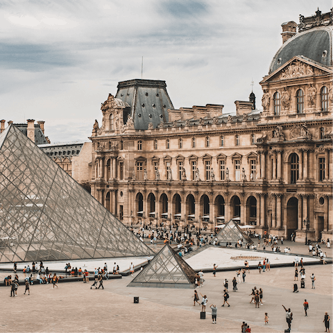 Discover the wealth of treasures housed in the iconic Louvre Museum – a leisurely twenty-minute stroll from your apartment 