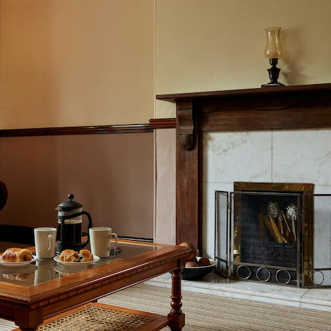 Spend cosy afternoons chatting away in your traditional living room, sipping on tea while the fireplace warms you up
