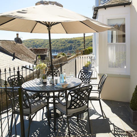 Admire the glimpses of the estuary and wooded hillside from the private front terrace