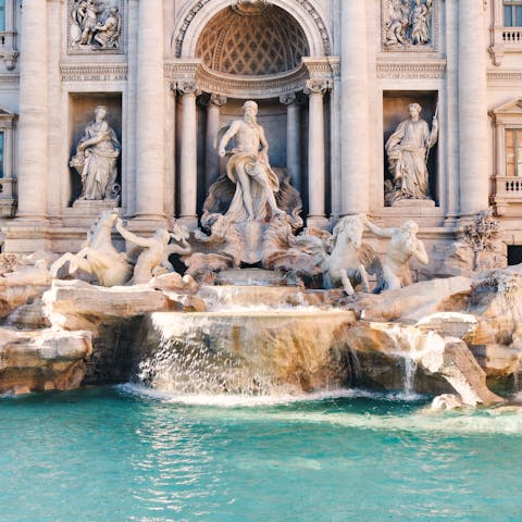 Make a wish at the Trevi Fountain, a fifteen-minute walk away