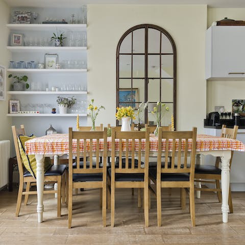 Gather together for a celebratory feast at the farmhouse-style dining table