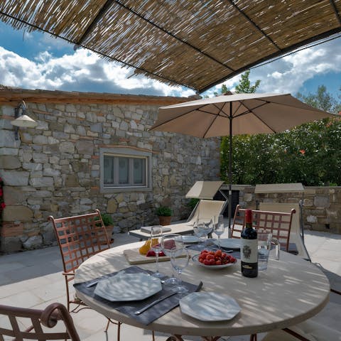 Sip a glass of Chianti wine over lunch in the outside dining area