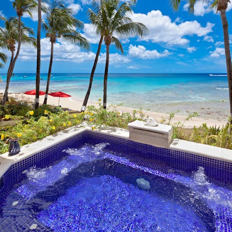 Gaze out over the ocean from your private, jetted plunge pool