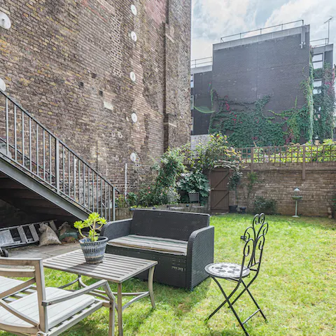 Light up the barbecue and enjoy an alfresco feast out in the home's garden