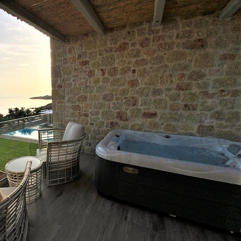 Sit back in the hot tub on the balcony and look out over the Ionian Sea