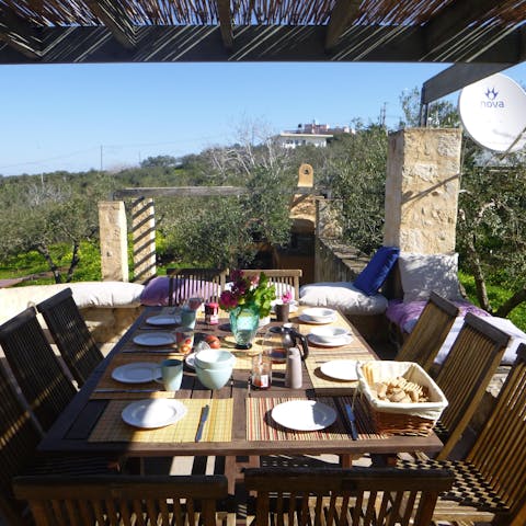 Gather everybody together for a meal on the balcony's alfresco table