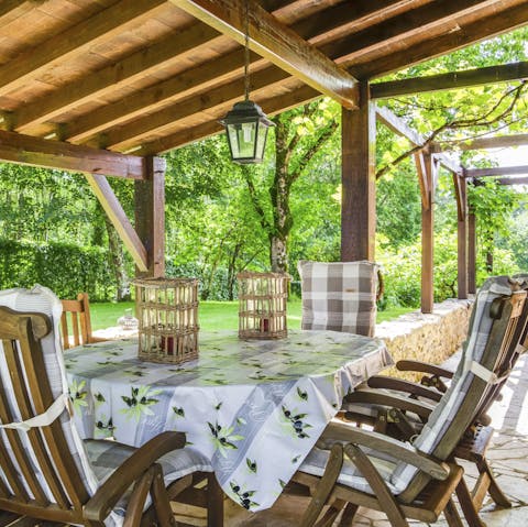 Relax in the shade of the alfresco dining table after brunch