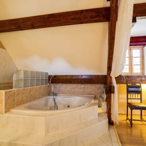 Soak in the jacuzzi under the eaves of the master bedroom