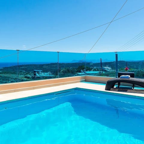 Admire the shades of blue on blue from the calm of the swimming pool