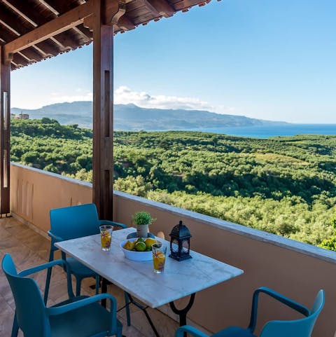 Enjoy a cold drink as the sun sets over the beautiful Crete coast