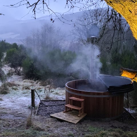 Admire the highlands view from the warmth of a private soaking hot tub