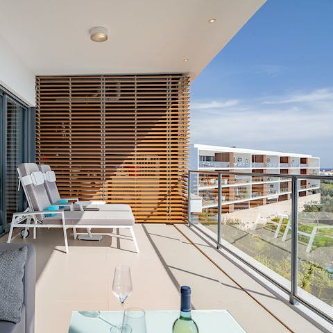 Work on that perfect bronze tan on the private balcony