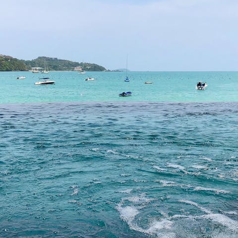 Gaze out at the crystal blue vistas from your beachfront location