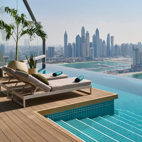 Stretch out on a sun lounger by the rooftop infinity pool – the highest in the city