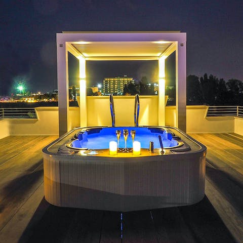 Soak in the Jacuzzi and enjoy the sea views at sunset