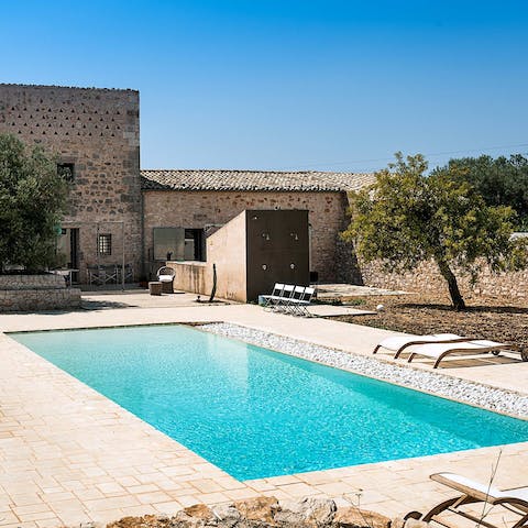 Soak up the sun beside the private swimming pool