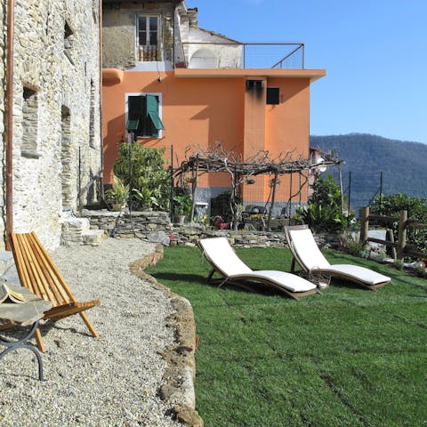 Bask on the beautifully-tended terraced garden