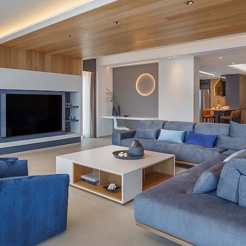 Organise a movie night with your friends and family, lounging on the luxurious sofas 