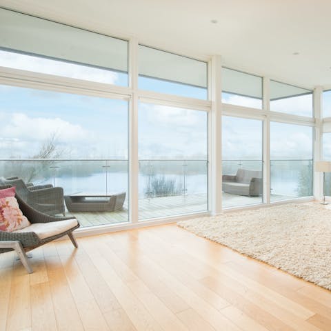 Take in serene waterside views from the living area and private terrace 