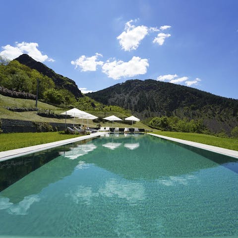 Swim laps in the long pool overlooking the Ligurian hills
