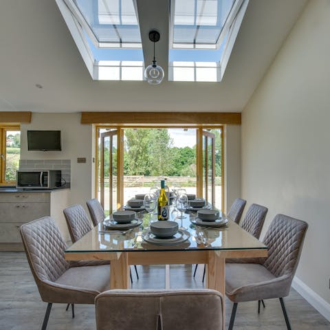 Fling the patio doors wide open and enjoy a convivial meal under the skylights 